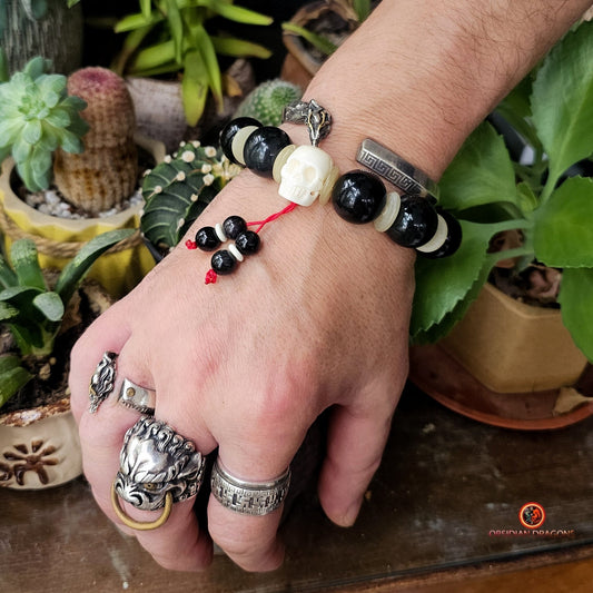Bracelet en obsidienne oeil céleste artisanal- crâne sculpté | obsidian dragons