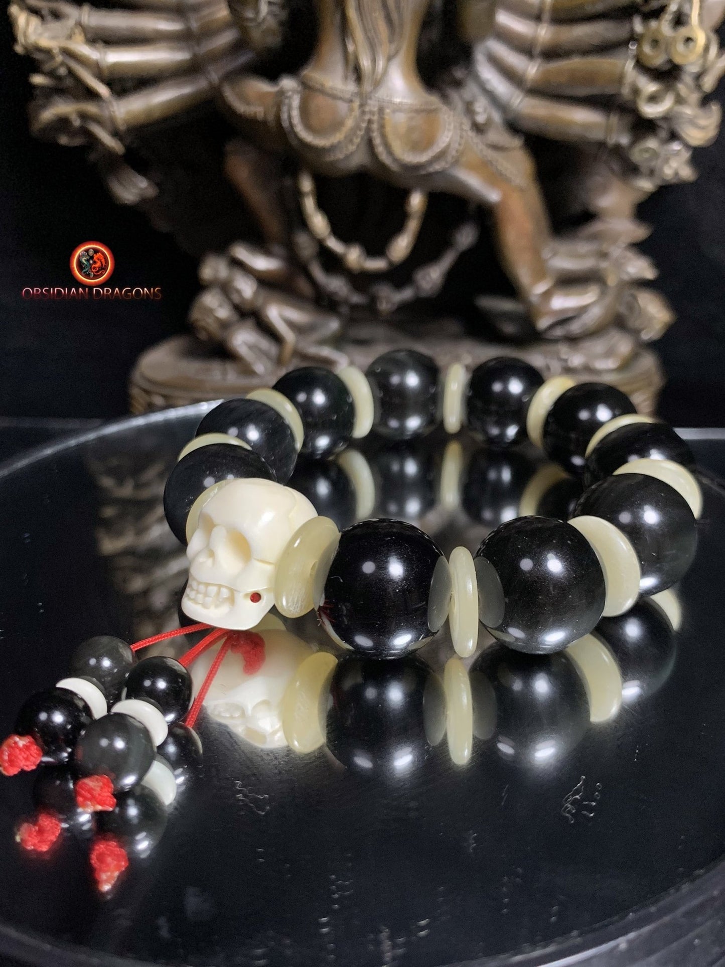 Bracelet en obsidienne oeil céleste artisanal- crâne sculpté | obsidian dragons
