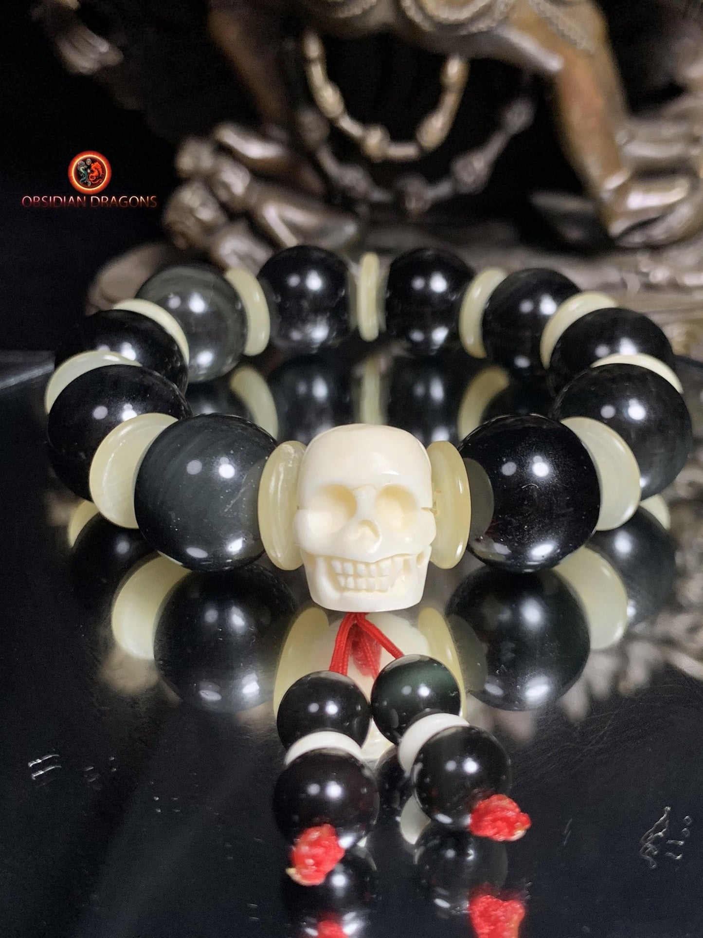 Bracelet en obsidienne oeil céleste artisanal- crâne sculpté | obsidian dragons