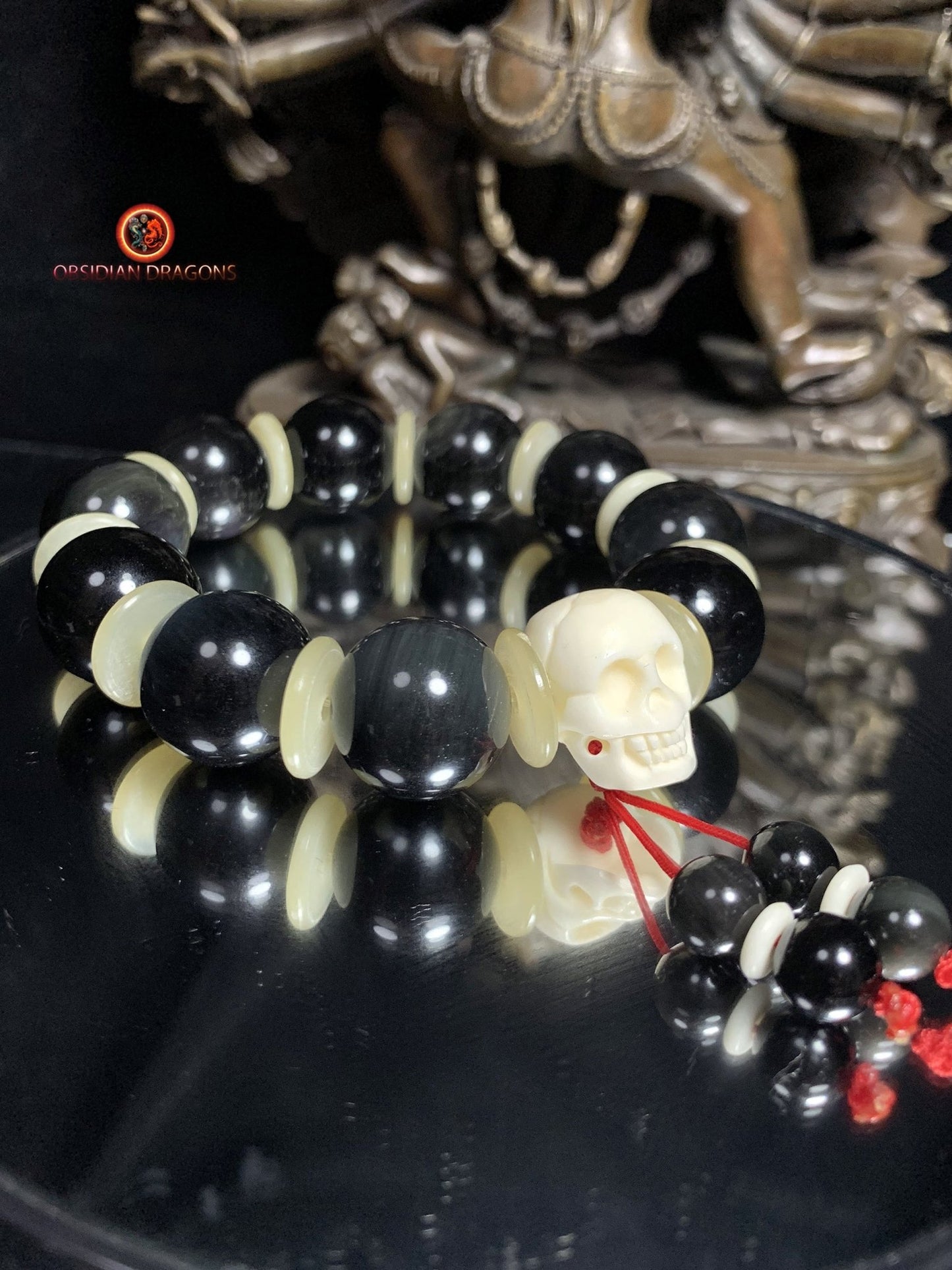 Bracelet en obsidienne oeil céleste artisanal- crâne sculpté | obsidian dragons