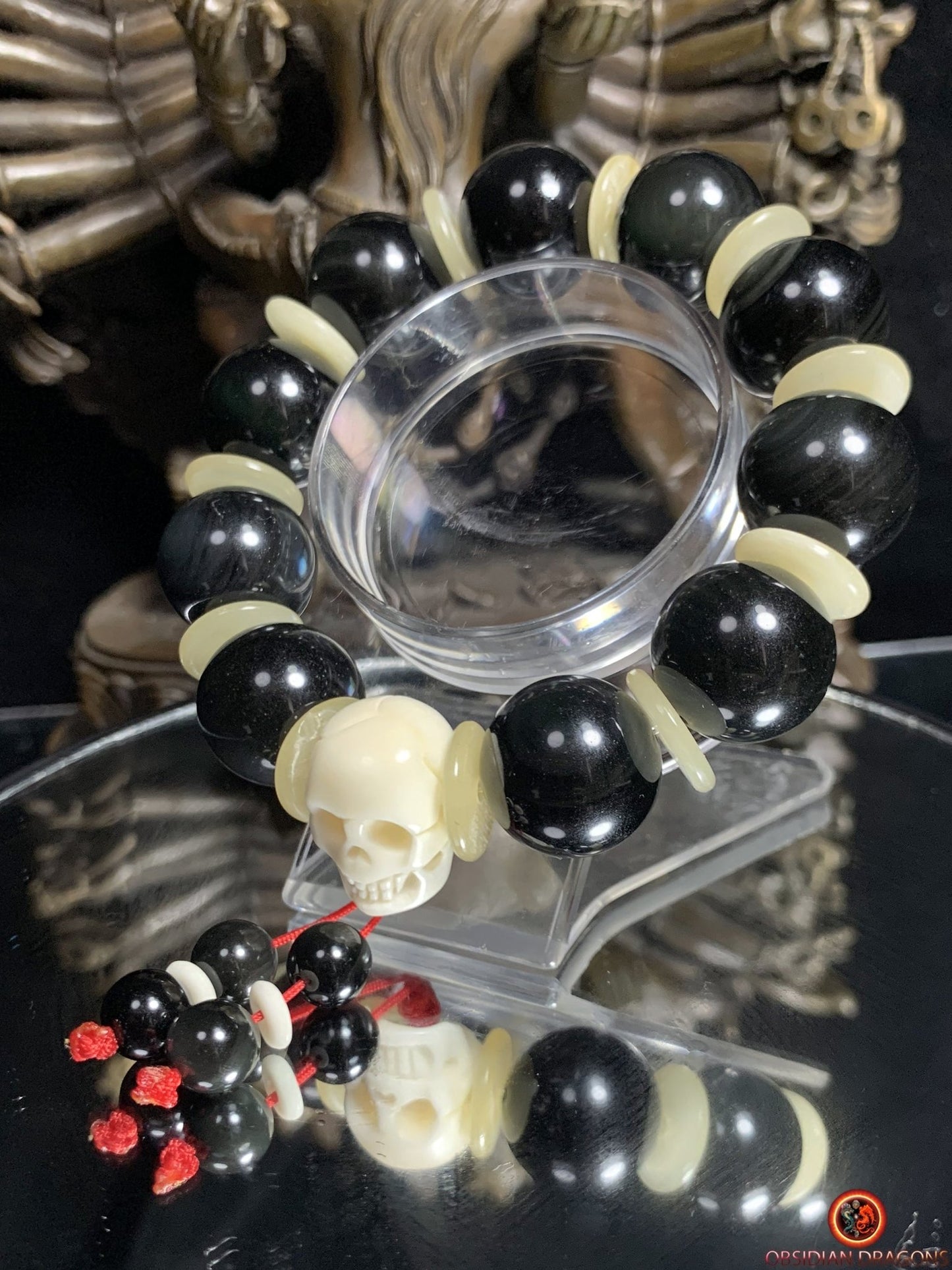 Bracelet en obsidienne oeil céleste artisanal- crâne sculpté | obsidian dragons