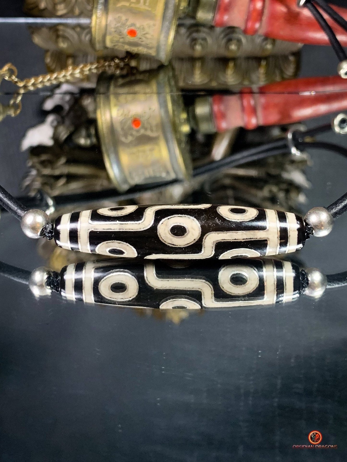 Collier Dzi à 9 Yeux Authentique – Vision et Protection | obsidian dragons