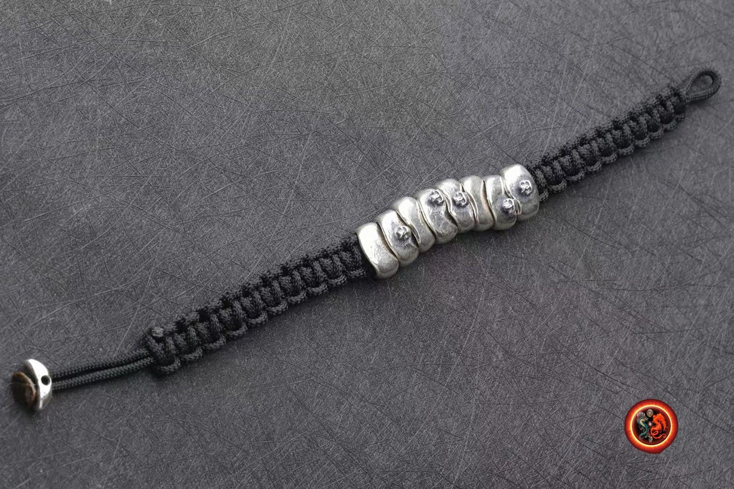Bracelet cranes, skull. argent 925 poinçonné, Tressé avec de la corde pour parachute ultra resistante, fermoir coulissant reglable - obsidian dragon
