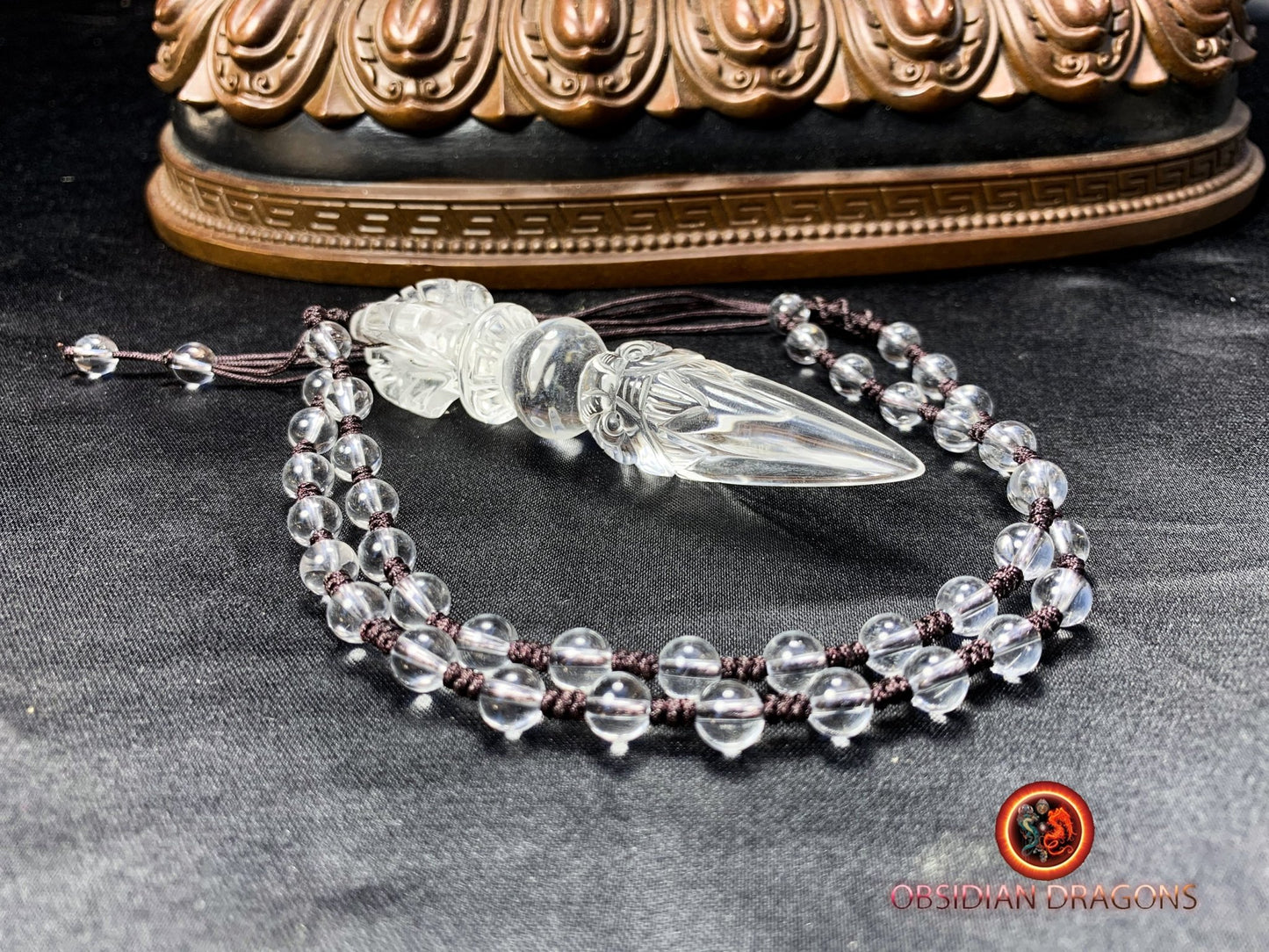 Pendentif dague phurba en cristal de roche, bouddhisme vajrayana. Dague rituelle pour chasser les démons - obsidian dragon