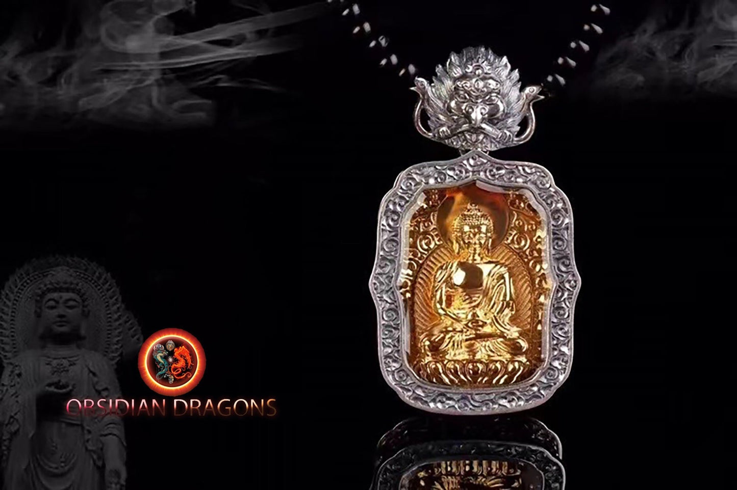Pendentif bouddha Amitabha, amulette de protection du bouddhisme vajrayana esoterique tibétain. représentation de Garuda sur la beliere. - obsidian dragon