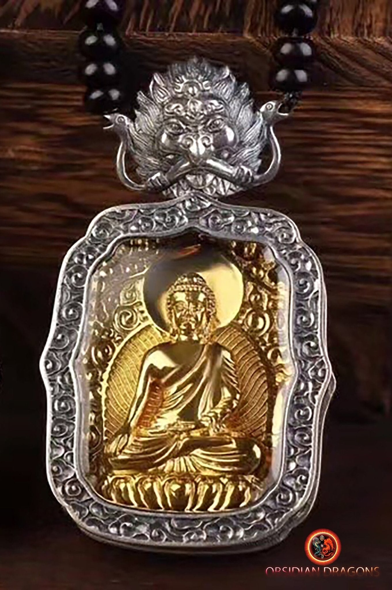 Pendentif bouddha Sakyamuni, amulette de protection du bouddhisme vajrayana esoterique tibétain. représentation de Garuda sur la beliere. - obsidian dragon
