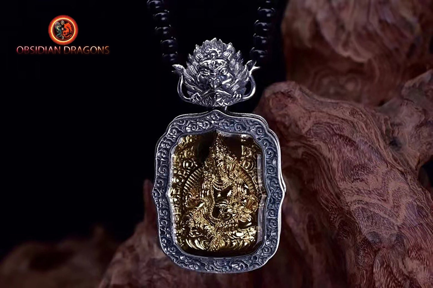 Pendentif bouddha. Jambhala, déité de la richesse. Amulette de protection du bouddhisme vajrayana esoterique tibétain. représentation de Garuda sur la beliere. - obsidian dragon