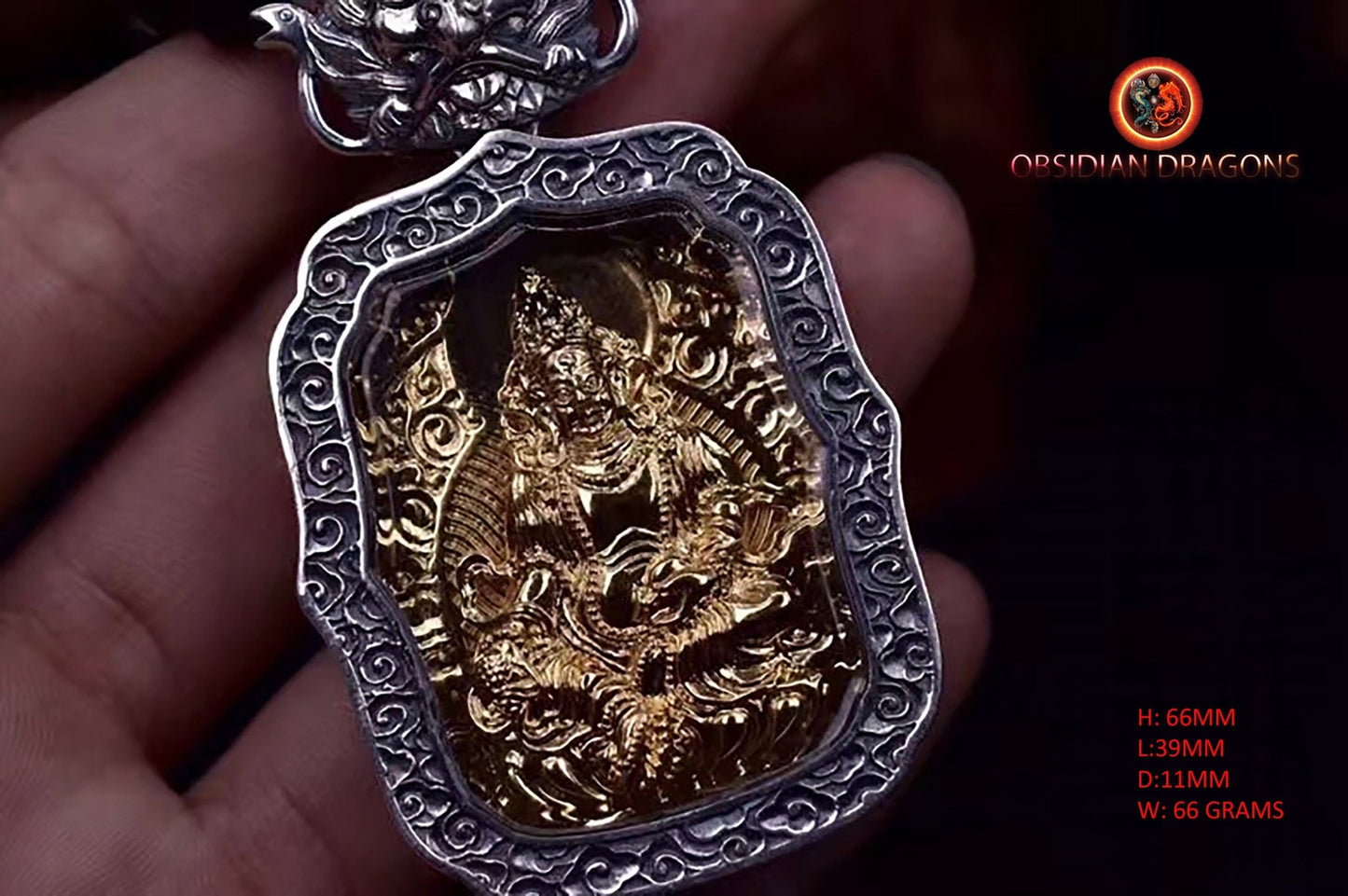 Pendentif bouddha. Jambhala, déité de la richesse. Amulette de protection du bouddhisme vajrayana esoterique tibétain. représentation de Garuda sur la beliere. - obsidian dragon
