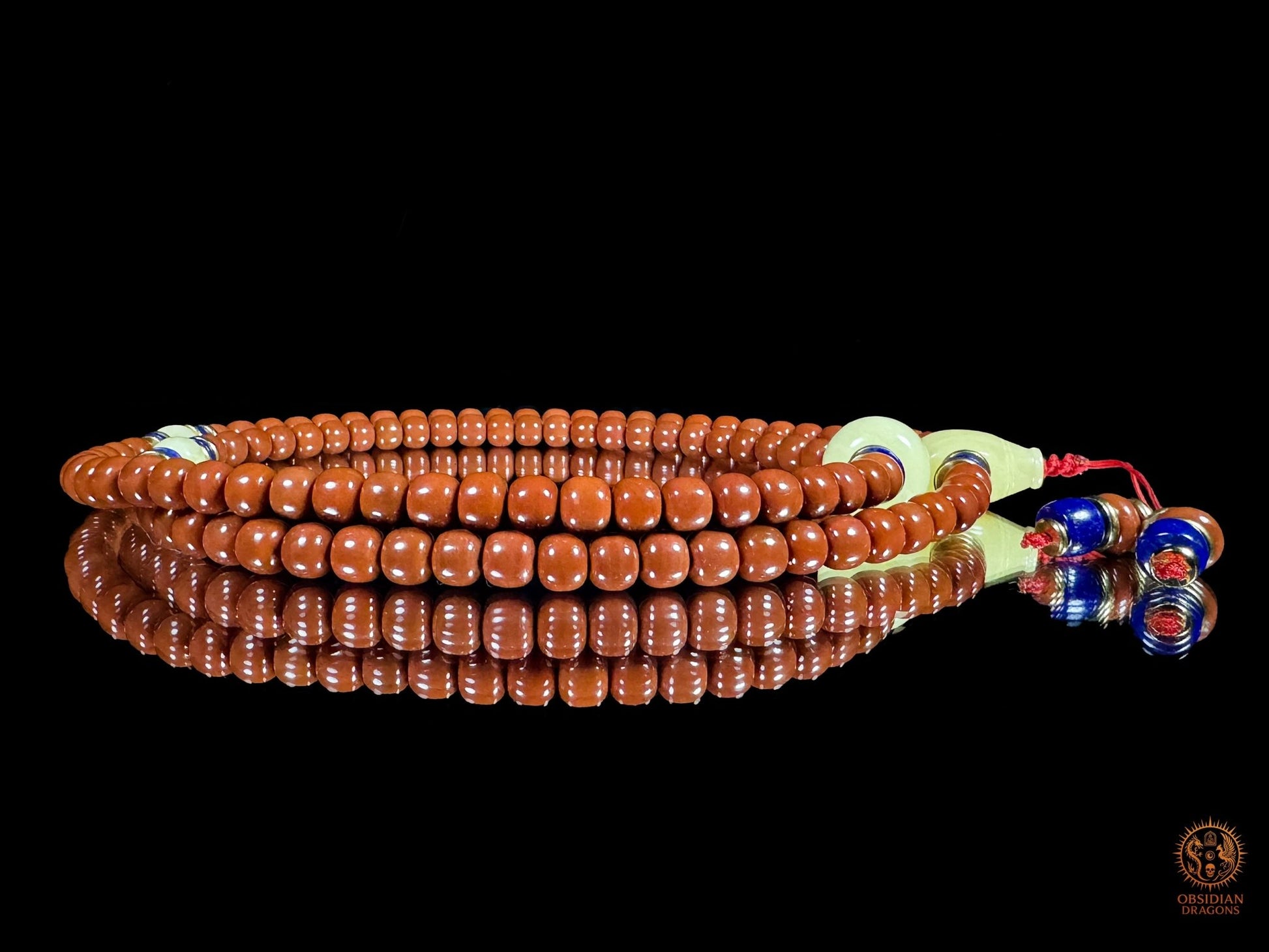 Mala 108 perles en agate Nan Hong de baoshan & ambre royal | obsidian dragons