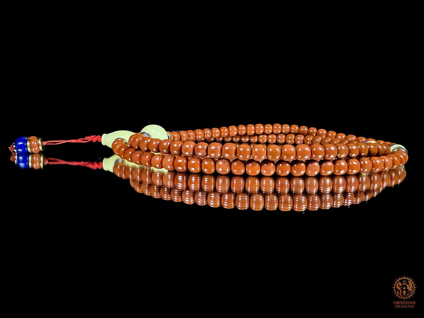 Mala 108 perles en agate Nan Hong de baoshan & ambre royal | obsidian dragons