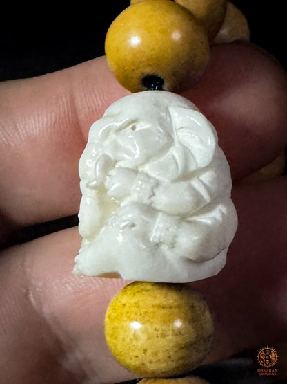 Profil de la sculpture Ganesh en bois de cerf, contre-perle du bracelet mala bouddhiste inspiré du Shibazi chinois