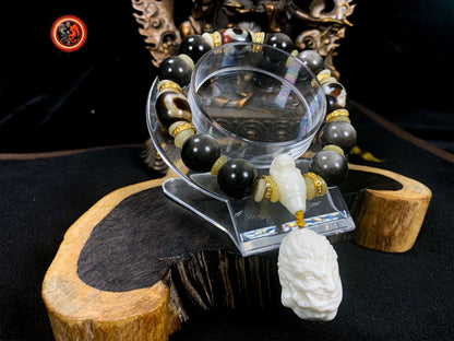 Bracelet mala, bouddhiste, bouddha. Meditation. obsidienne argentées, agates sacrées tibétaines "DZI" authentiques. Bouddha sakyamuni/ Acala - obsidian dragon