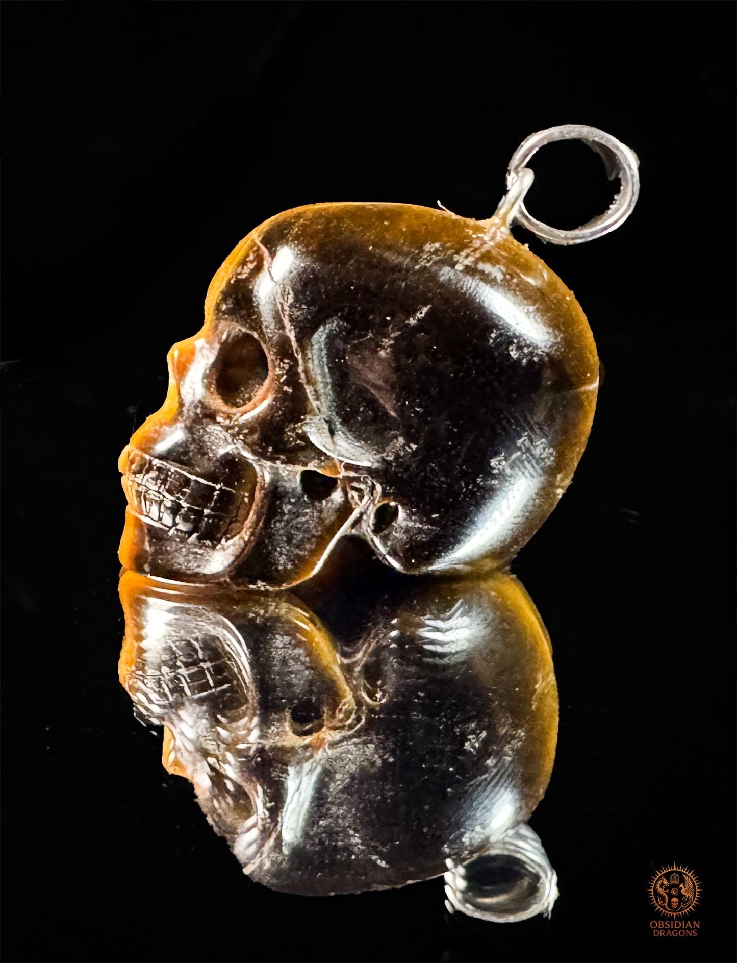 Pendentif crâne en œil de tigre naturel | obsidian dragons
