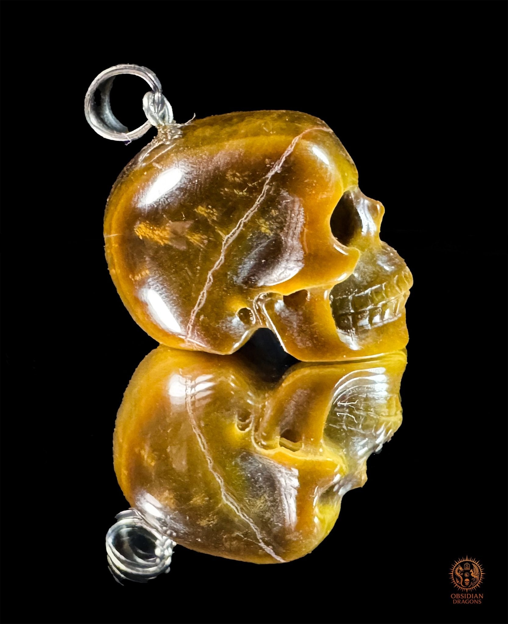 Pendentif crâne en œil de tigre naturel | obsidian dragons
