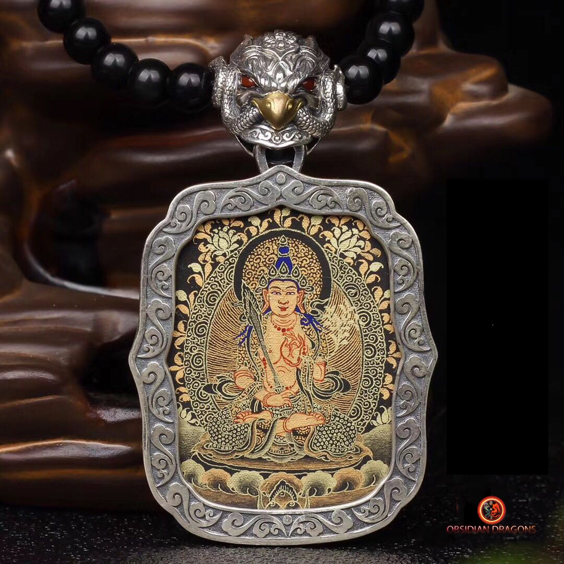 Pendentif Bouddha. Tangka artisanal d'Akashagarba bodhisattva. Bélière Garuda - obsidian dragon